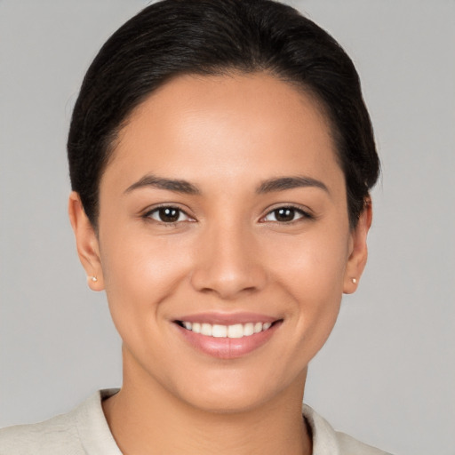 Joyful white young-adult female with short  brown hair and brown eyes