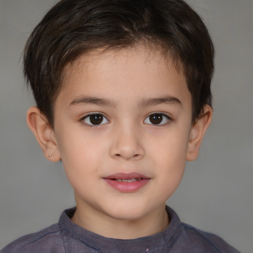 Joyful white child male with short  brown hair and brown eyes