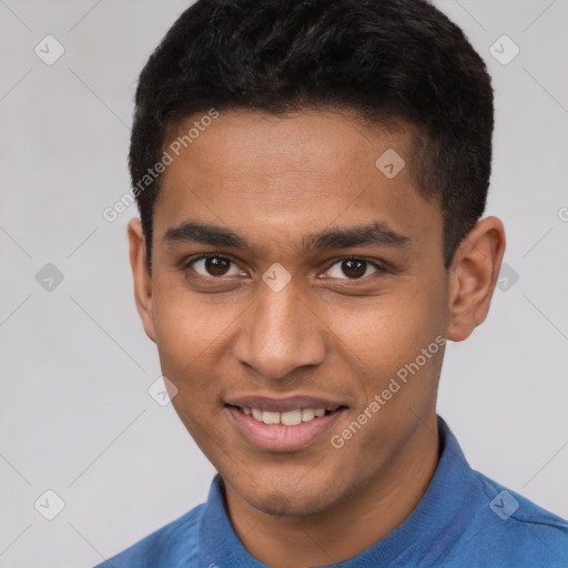 Joyful latino young-adult male with short  brown hair and brown eyes