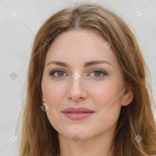 Joyful white young-adult female with long  brown hair and green eyes