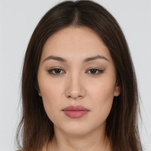 Neutral white young-adult female with long  brown hair and brown eyes