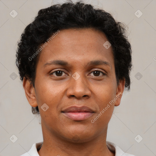 Joyful black adult female with short  brown hair and brown eyes