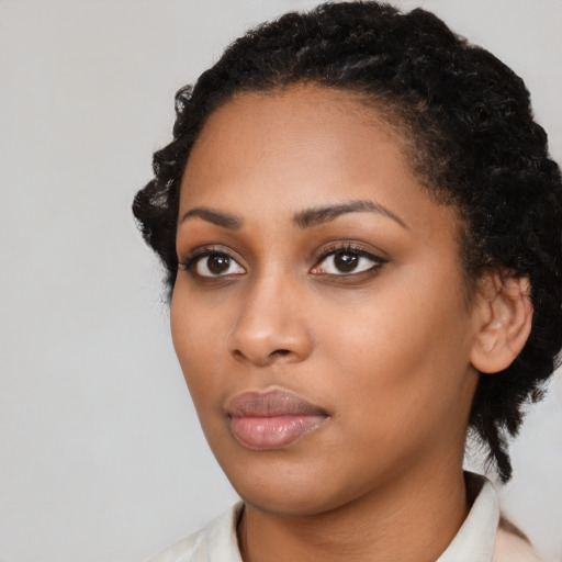 Neutral black young-adult female with short  black hair and brown eyes