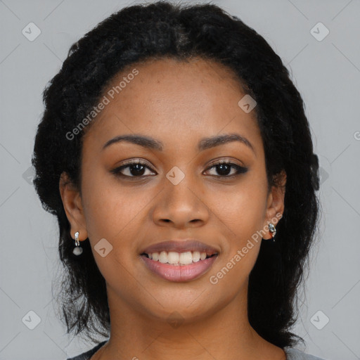 Joyful black young-adult female with long  black hair and brown eyes