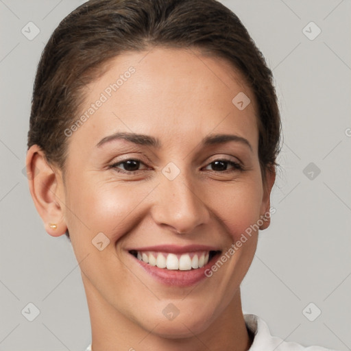 Joyful white young-adult female with short  brown hair and brown eyes