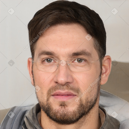 Joyful white adult male with short  brown hair and brown eyes