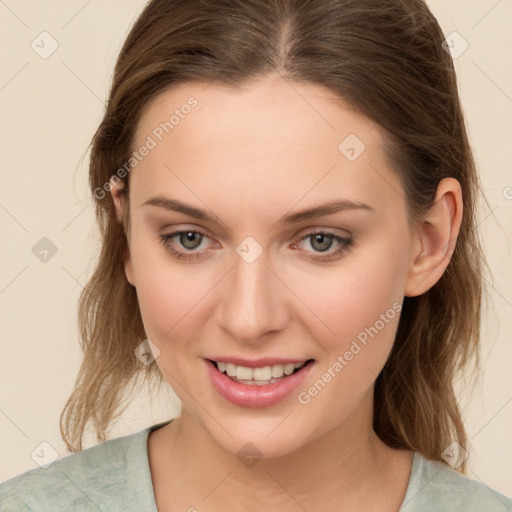 Joyful white young-adult female with medium  brown hair and green eyes