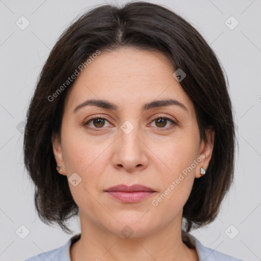 Joyful white adult female with medium  brown hair and brown eyes