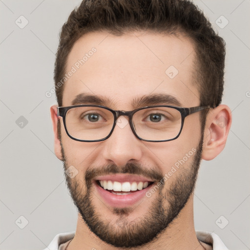 Joyful white young-adult male with short  brown hair and brown eyes