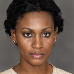 Neutral black young-adult female with short  brown hair and brown eyes