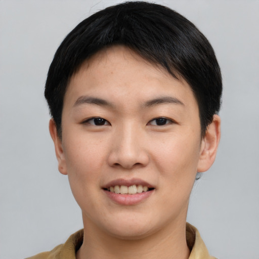 Joyful asian young-adult female with short  black hair and brown eyes