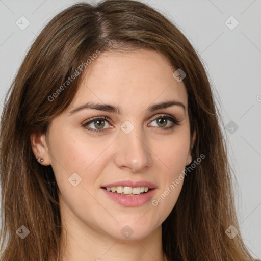 Joyful white young-adult female with long  brown hair and green eyes