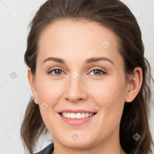 Joyful white young-adult female with medium  brown hair and grey eyes