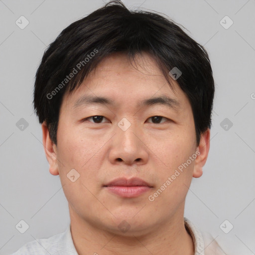 Neutral asian young-adult male with short  brown hair and brown eyes