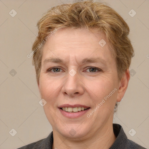 Joyful white adult female with short  brown hair and grey eyes