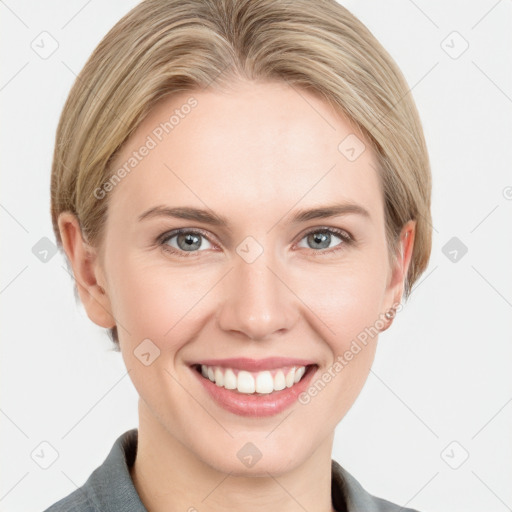 Joyful white young-adult female with medium  brown hair and grey eyes