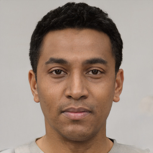 Neutral latino young-adult male with short  black hair and brown eyes