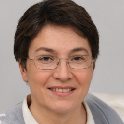 Joyful white adult female with short  brown hair and brown eyes