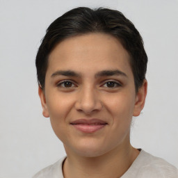 Joyful white young-adult female with short  brown hair and brown eyes