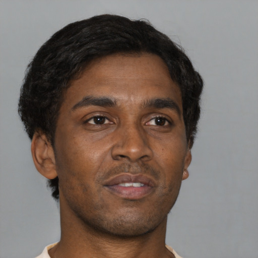 Neutral black adult male with short  brown hair and brown eyes