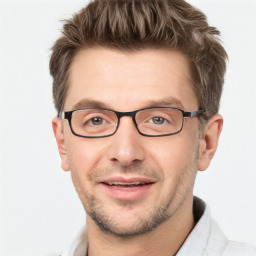 Joyful white adult male with short  brown hair and grey eyes