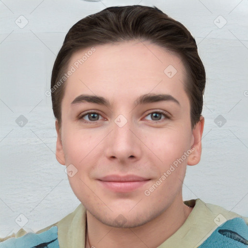 Joyful white young-adult male with short  brown hair and grey eyes