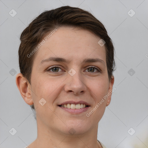 Joyful white young-adult female with short  brown hair and grey eyes