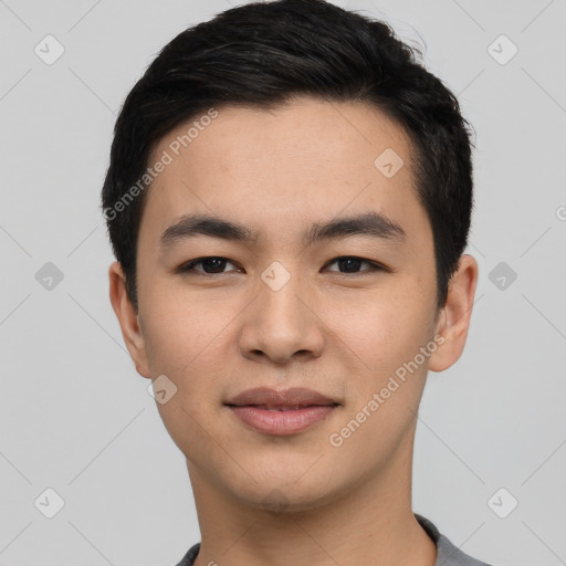 Joyful asian young-adult male with short  black hair and brown eyes