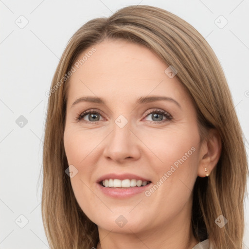 Joyful white young-adult female with long  brown hair and green eyes