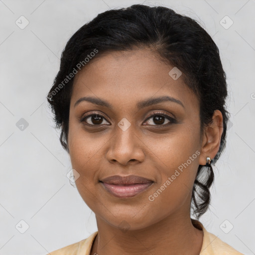 Joyful black young-adult female with medium  brown hair and brown eyes