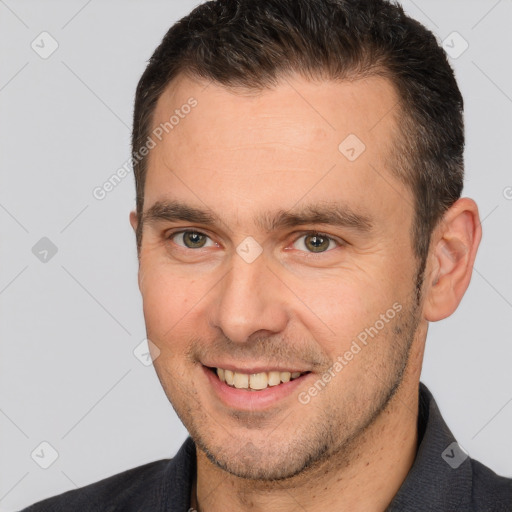 Joyful white young-adult male with short  brown hair and brown eyes