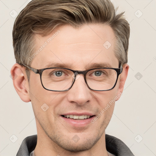 Joyful white adult male with short  brown hair and grey eyes