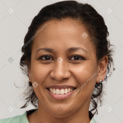 Joyful latino adult female with medium  brown hair and brown eyes