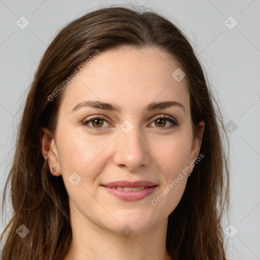 Joyful white young-adult female with long  brown hair and green eyes