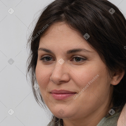 Joyful white adult female with medium  brown hair and brown eyes