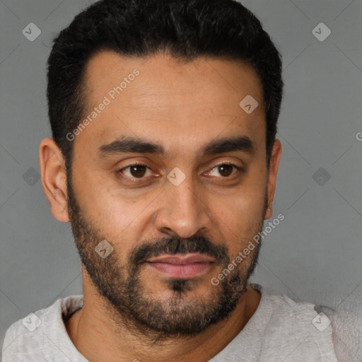 Joyful latino young-adult male with short  black hair and brown eyes