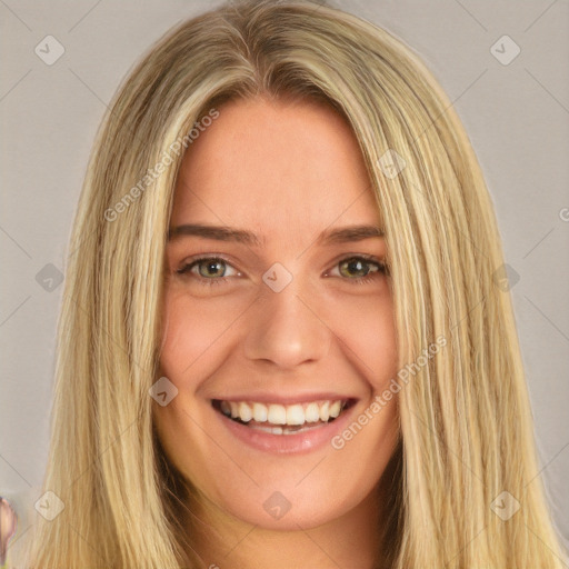 Joyful white young-adult female with long  brown hair and green eyes