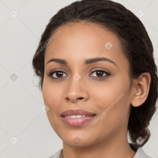 Joyful latino young-adult female with long  brown hair and brown eyes