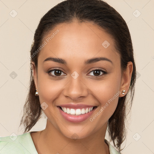 Joyful white young-adult female with long  brown hair and brown eyes