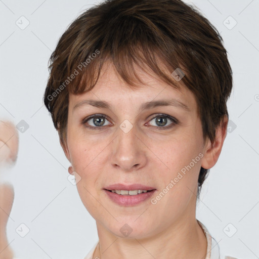 Joyful white young-adult female with short  brown hair and grey eyes