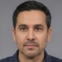 Neutral white adult male with short  black hair and brown eyes
