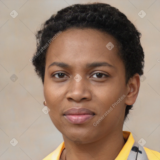 Joyful black young-adult female with short  black hair and brown eyes