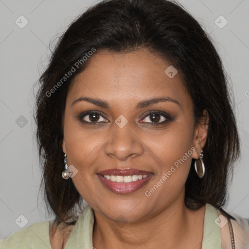 Joyful black young-adult female with long  brown hair and brown eyes