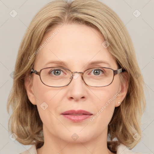 Joyful white adult female with medium  brown hair and blue eyes