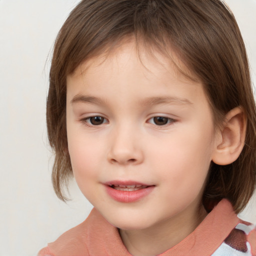 Joyful white child female with medium  brown hair and brown eyes