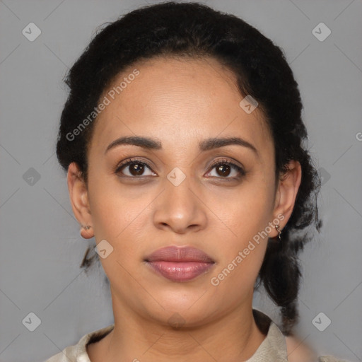 Joyful latino young-adult female with medium  brown hair and brown eyes