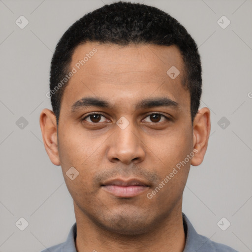 Neutral latino young-adult male with short  black hair and brown eyes