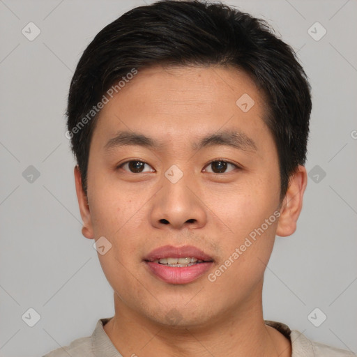 Joyful asian young-adult male with short  brown hair and brown eyes