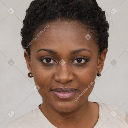 Joyful black young-adult female with short  black hair and brown eyes