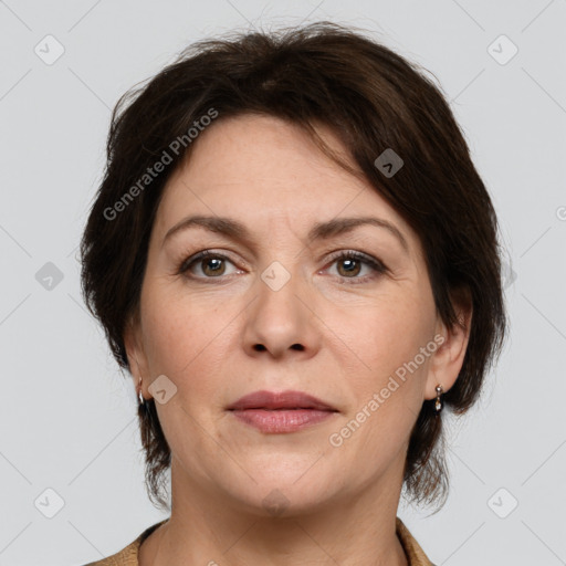 Joyful white adult female with medium  brown hair and brown eyes